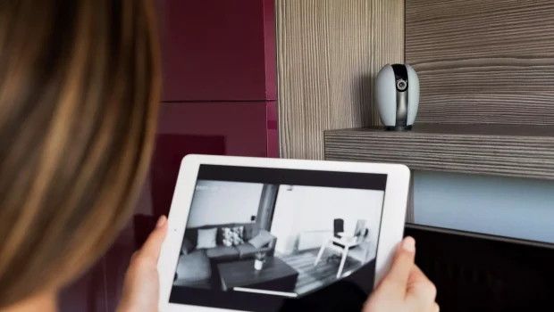 close-up-woman-checking-security-camera